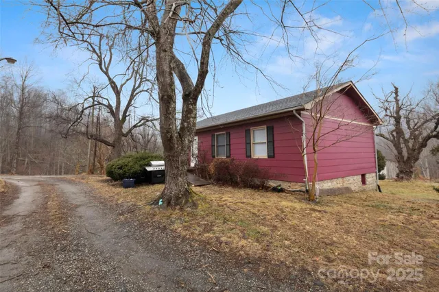 a view of a house with a yard covered with snow in the yard