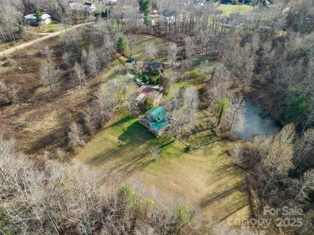 a aerial view of a house with a yard