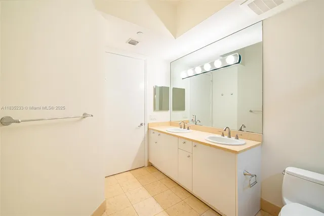 an empty room with a ceiling fan and window