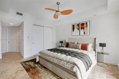 a bathroom with a shower a toilet and a glass window