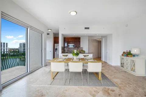 a dining room with a table and chairs