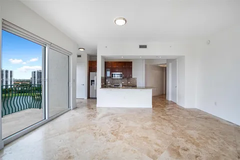 a kitchen with stainless steel appliances a sink a stove and a refrigerator