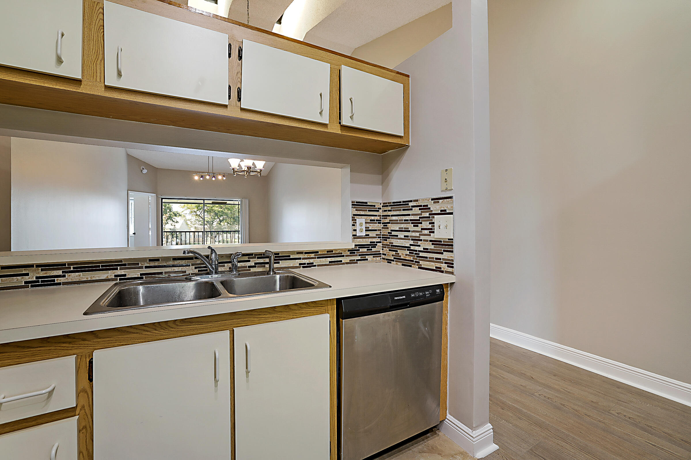 605 Harbour Pointe Way Greenacres, FL 33413 - Photo 11 of 48 a kitchen with granite countertop a sink and a stove