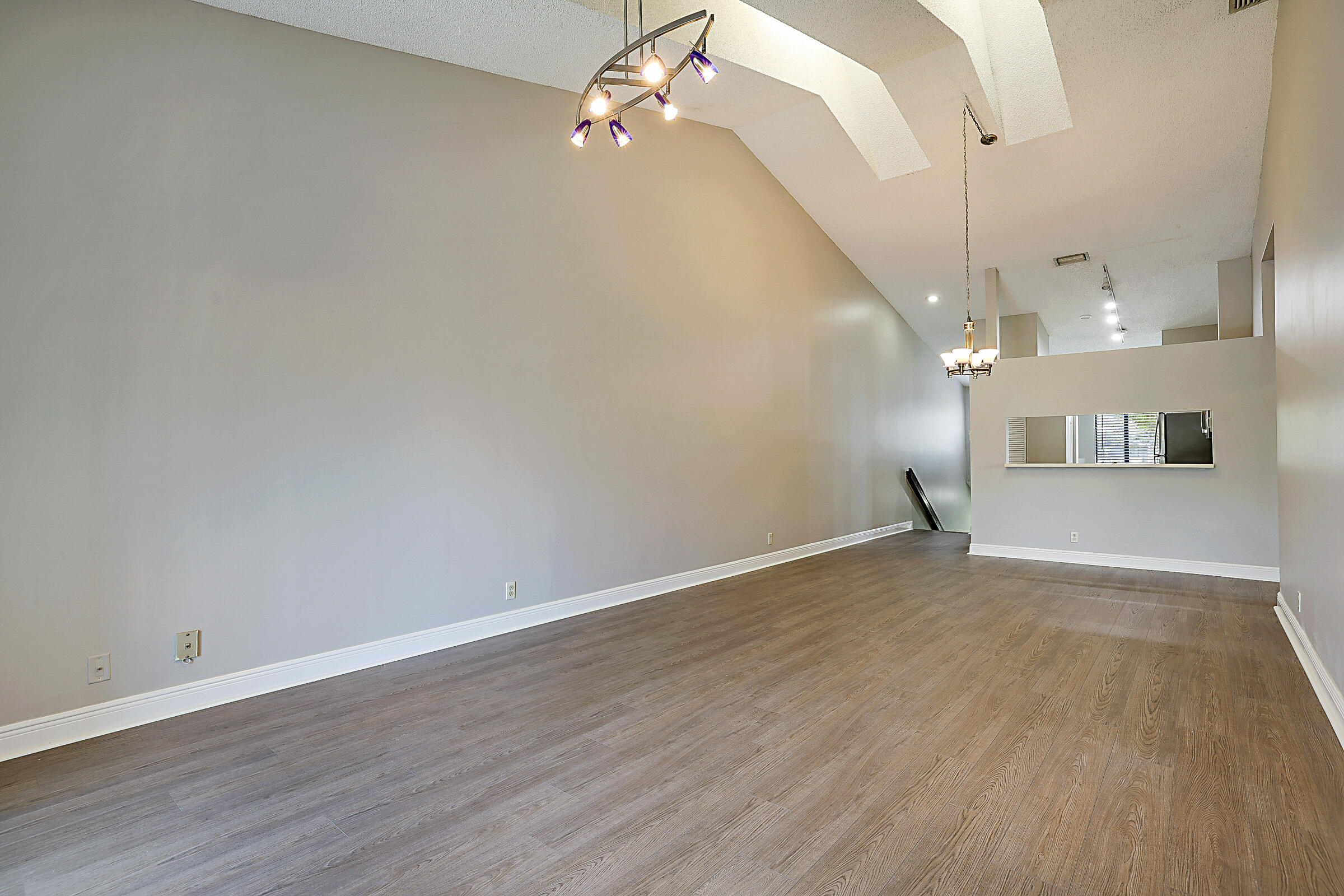 605 Harbour Pointe Way Greenacres, FL 33413 - Photo 18 of 48 a view of empty room with wooden floor and fan