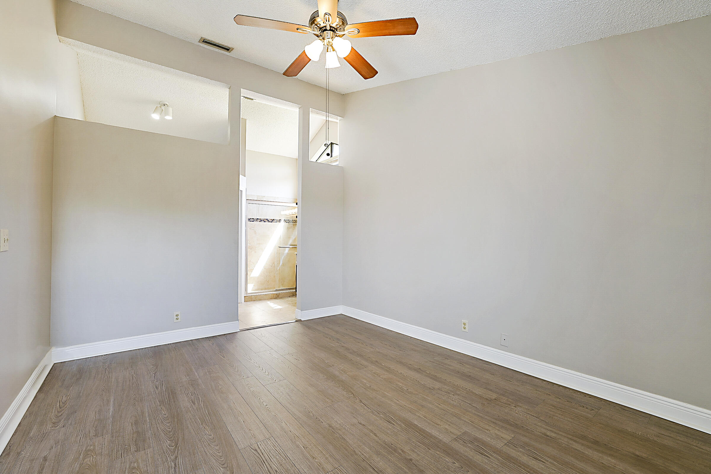 605 Harbour Pointe Way Greenacres, FL 33413 - Photo 19 of 48 wooden floor in an empty room with a window