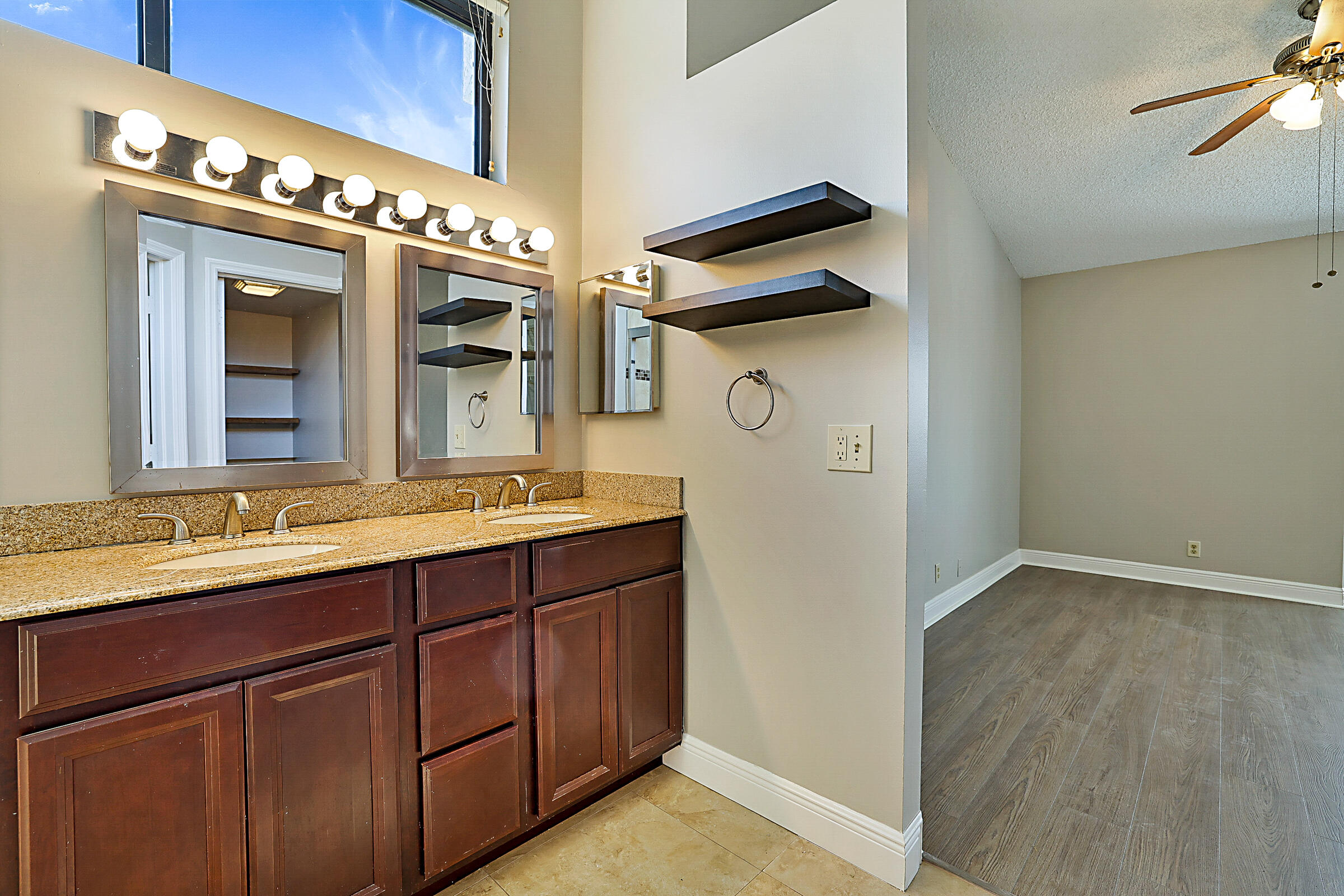 605 Harbour Pointe Way Greenacres, FL 33413 - Photo 24 of 48 a bathroom with a sink and a mirror