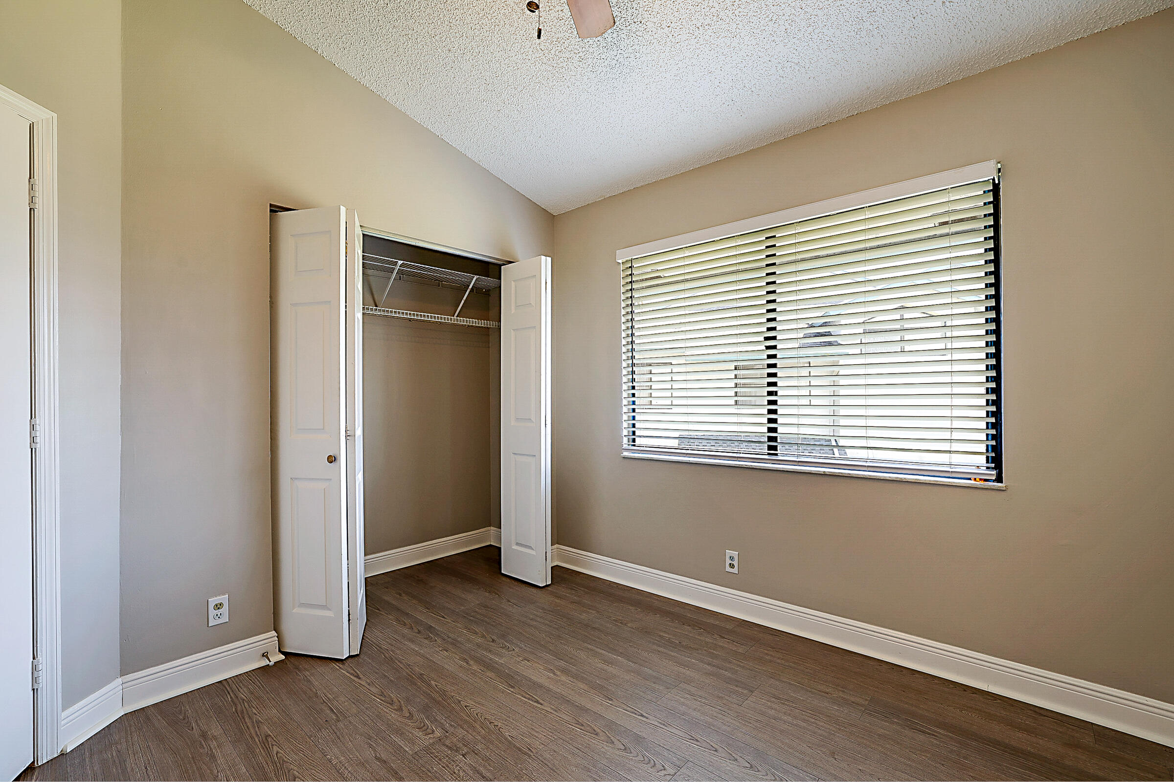 605 Harbour Pointe Way Greenacres, FL 33413 - Photo 34 of 48 an empty room with wooden floor and windows