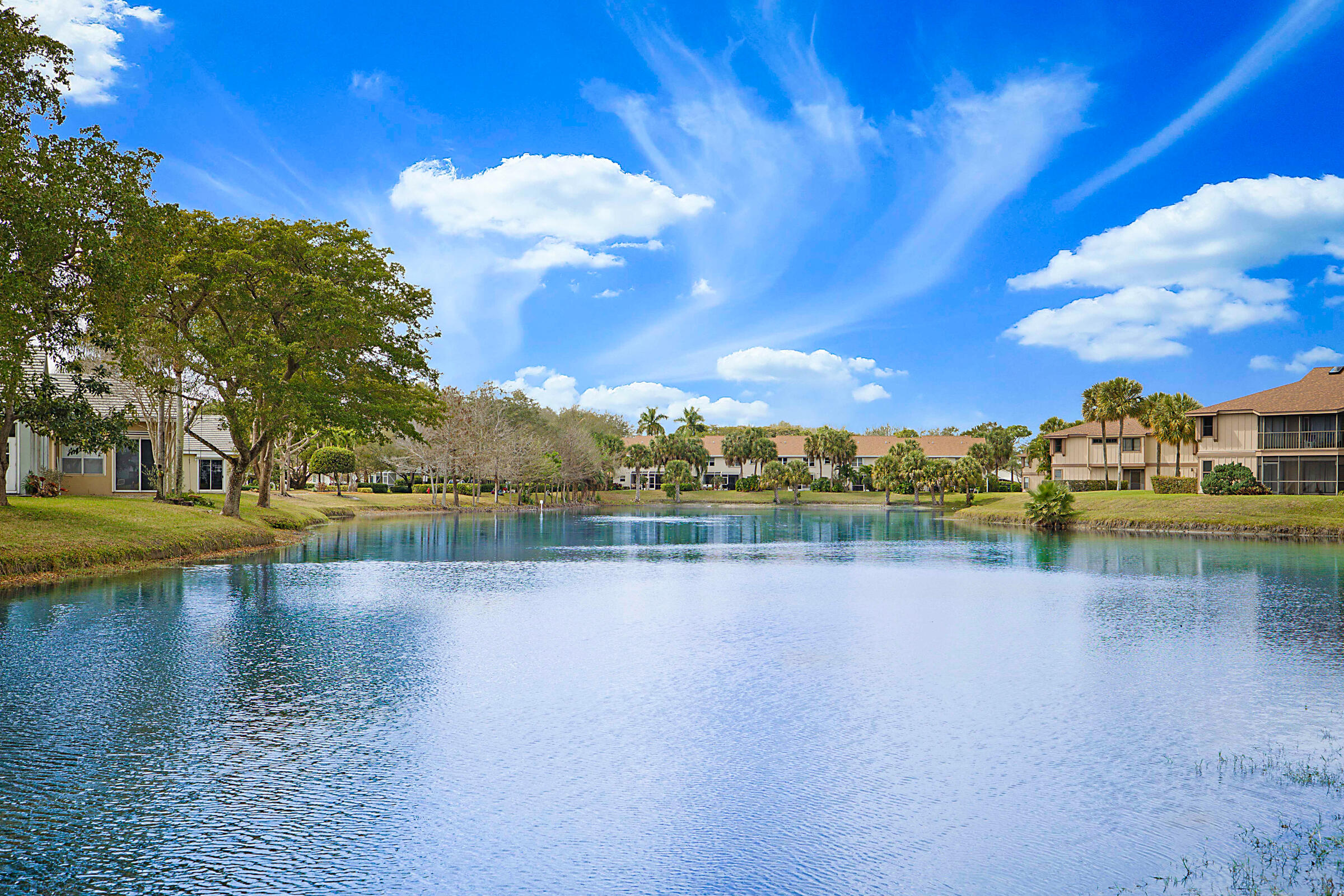 605 Harbour Pointe Way Greenacres, FL 33413 - Photo 39 of 48 a view of a lake with houses