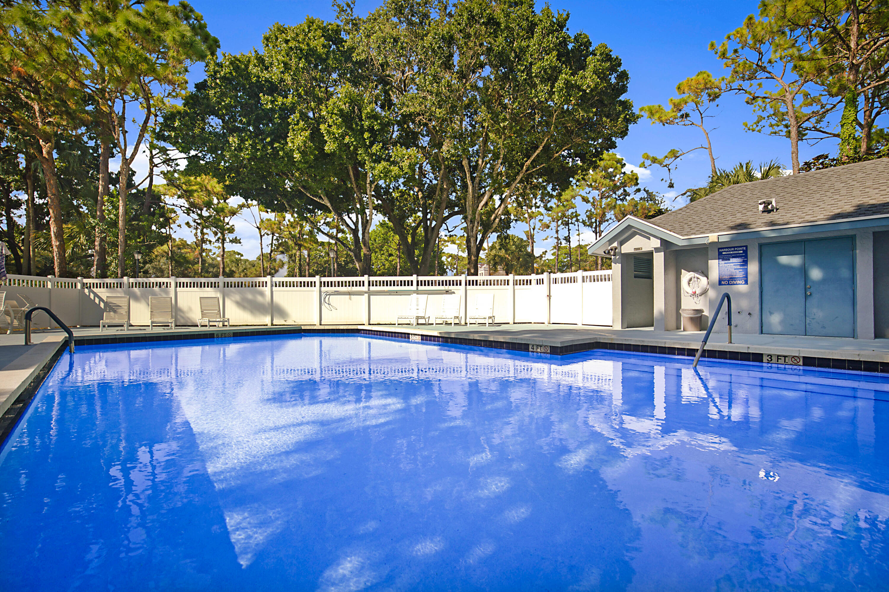 605 Harbour Pointe Way Greenacres, FL 33413 - Photo 41 of 48 a view of a swimming pool with a patio