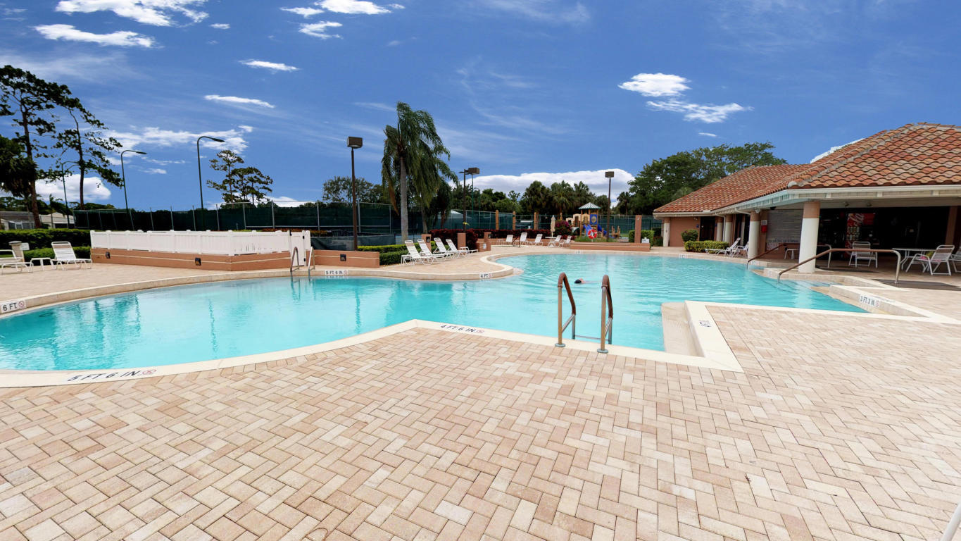 605 Harbour Pointe Way Greenacres, FL 33413 - Photo 44 of 48 a view of a house with swimming pool and sitting area