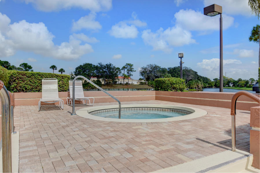 605 Harbour Pointe Way Greenacres, FL 33413 - Photo 45 of 48 a view of a swimming pool with a patio