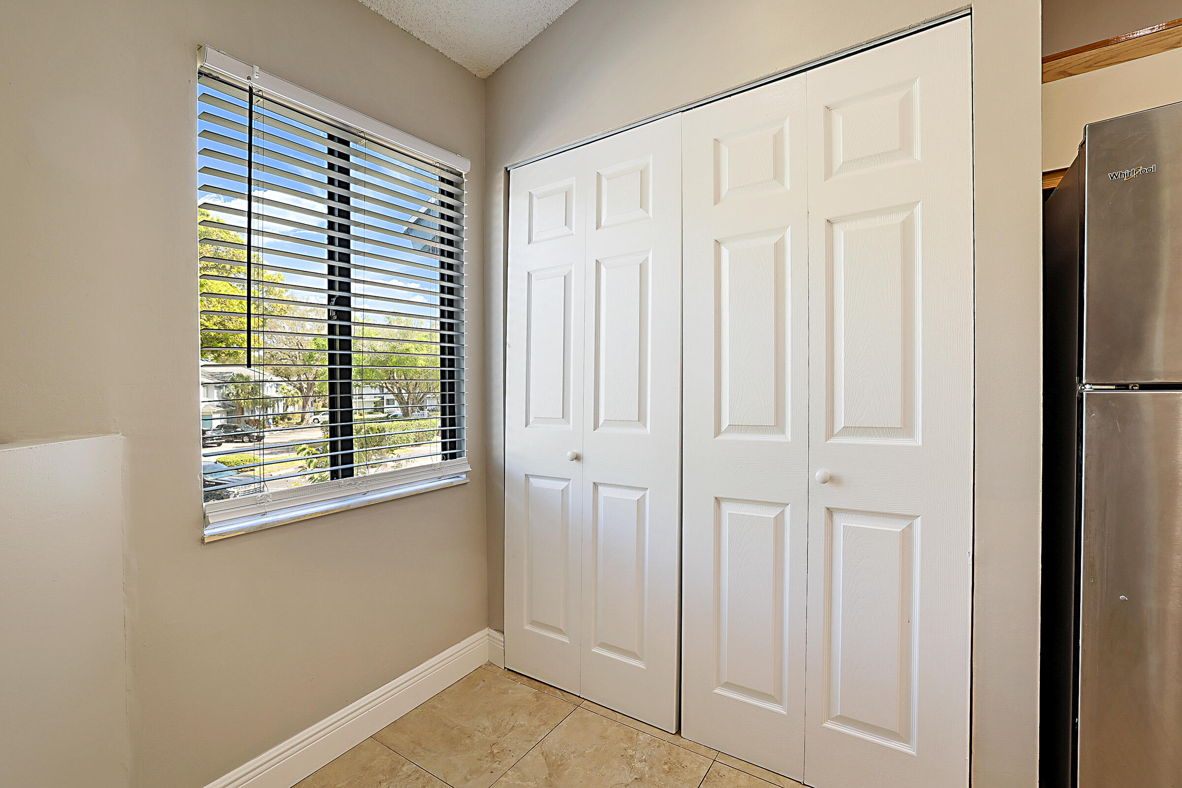 605 Harbour Pointe Way Greenacres, FL 33413 - Photo 9 of 48 a view of a closet area with entryway