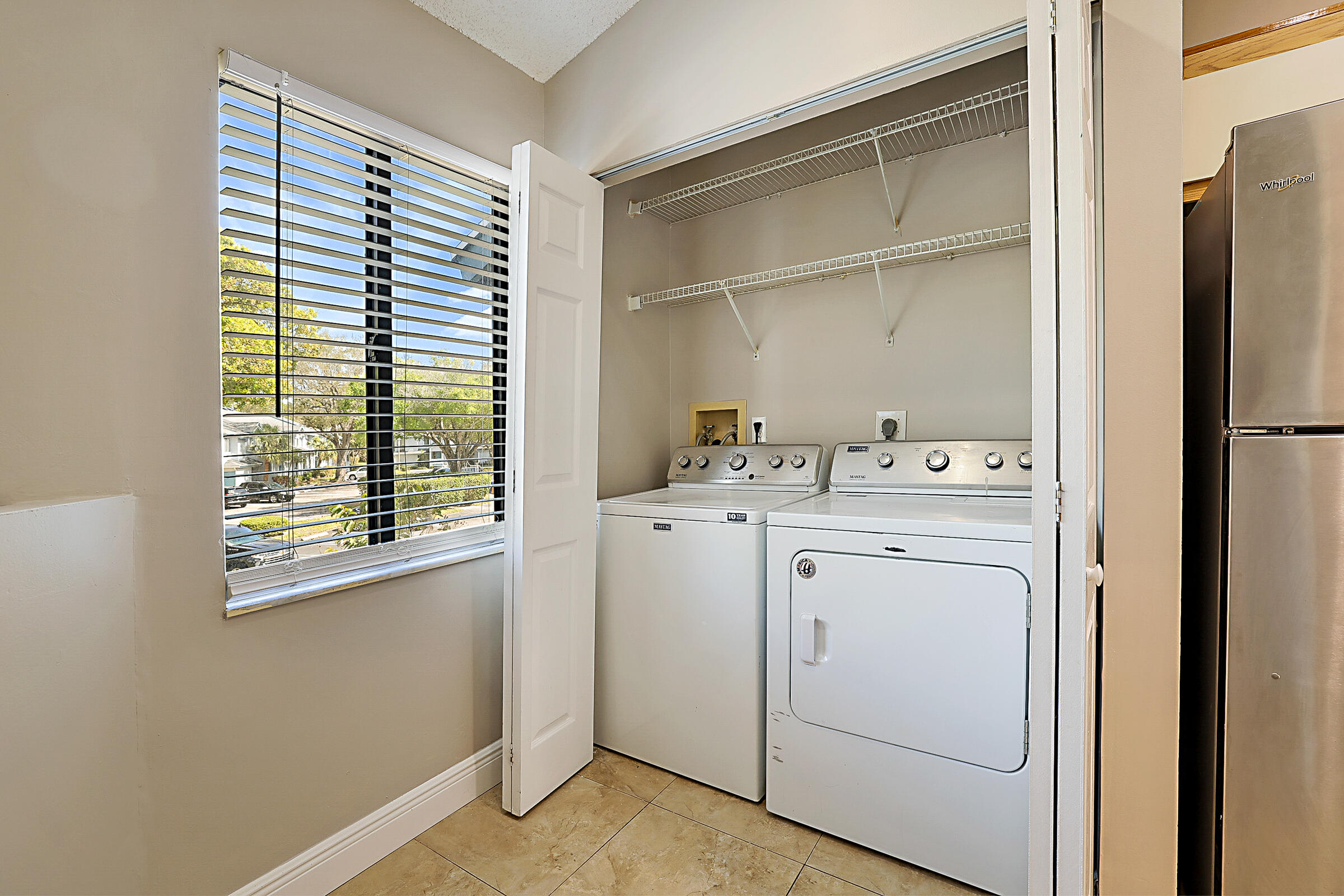 605 Harbour Pointe Way Greenacres, FL 33413 - Photo 10 of 48 a utility room with dryer and washer