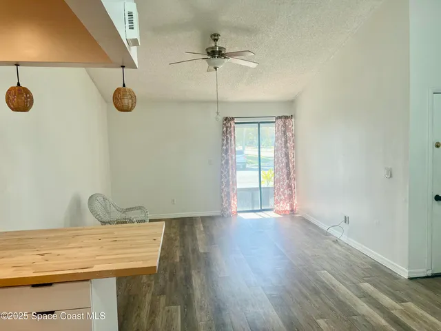 a view of an entryway with wooden floor