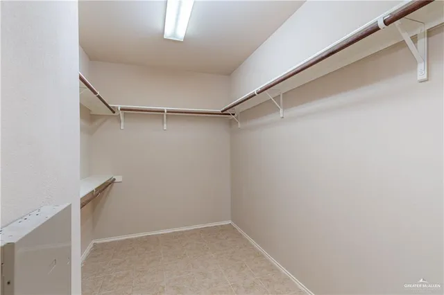 a view of an empty walk in closet