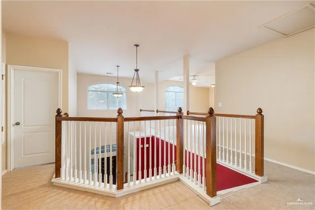 a view of a hallway with windows