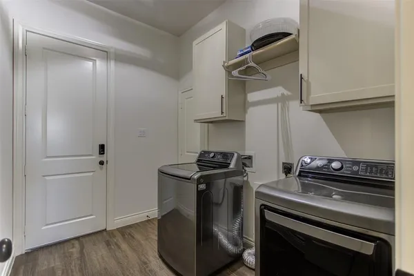 a kitchen with a stove and a microwave
