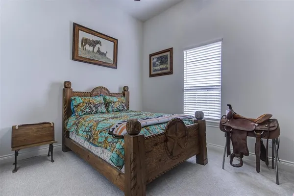 a bedroom with a bed and a chair