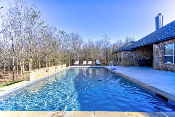 a view of outdoor space with wooden floor