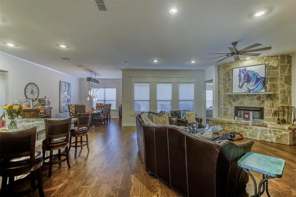 a living room with fireplace furniture and a flat screen tv