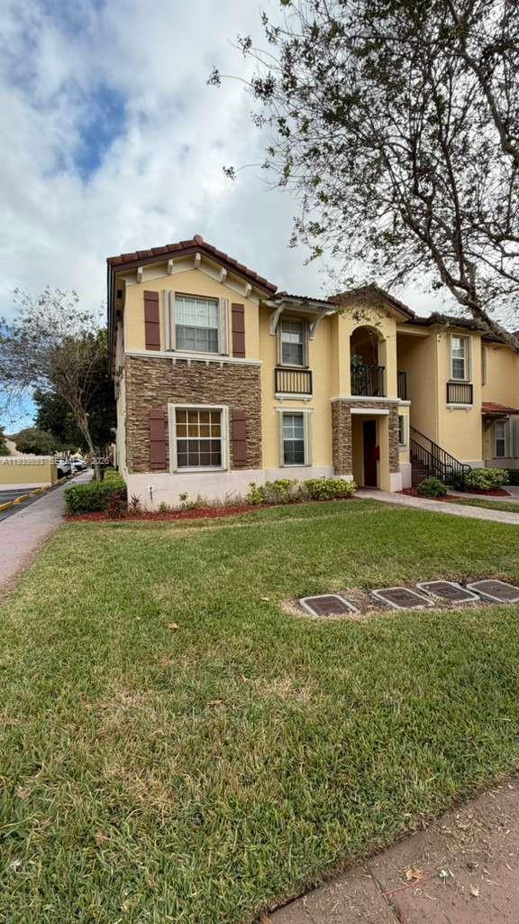 a front view of a house with a yard