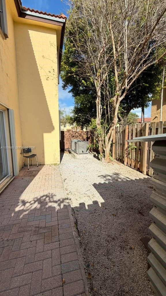 1555 Northeast 33rd Road, Unit 1012 Homestead, FL 33033 - Photo 15 of 54 a view of back yard of the house