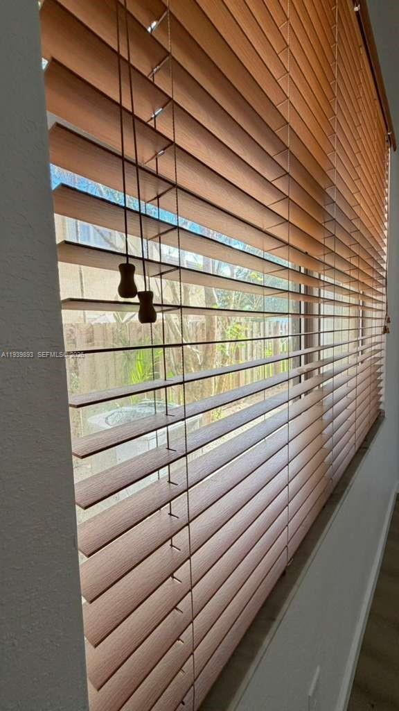 1555 Northeast 33rd Road, Unit 1012 Homestead, FL 33033 - Photo 26 of 54 a view of a wooden fence