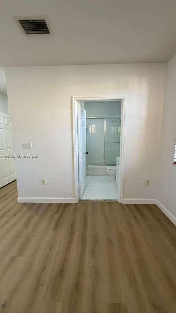 1555 Northeast 33rd Road, Unit 1012 Homestead, FL 33033 - Photo 29 of 54 wooden floor in a bathroom