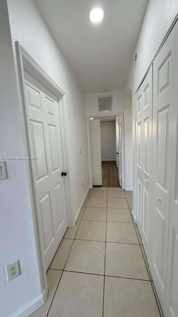 1555 Northeast 33rd Road, Unit 1012 Homestead, FL 33033 - Photo 31 of 54 a view of a hallway