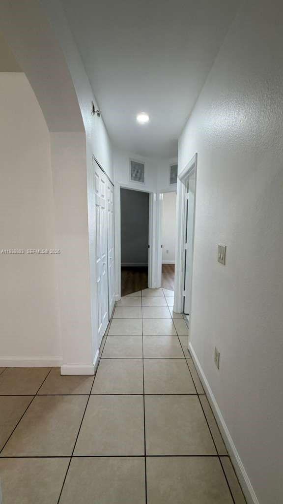 1555 Northeast 33rd Road, Unit 1012 Homestead, FL 33033 - Photo 32 of 54 a view of a hallway
