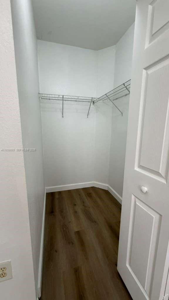 1555 Northeast 33rd Road, Unit 1012 Homestead, FL 33033 - Photo 35 of 54 a view of an empty walk in closet