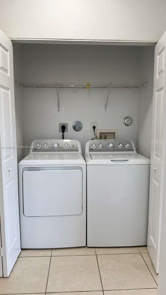 1555 Northeast 33rd Road, Unit 1012 Homestead, FL 33033 - Photo 46 of 54 a utility room with dryer and washer