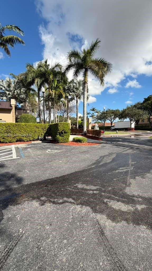 1555 Northeast 33rd Road, Unit 1012 Homestead, FL 33033 - Photo 48 of 54 a view of a street with a building in the background