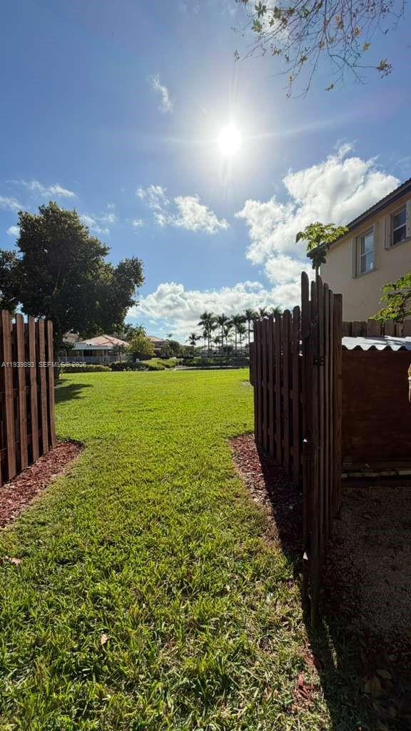 1555 Northeast 33rd Road, Unit 1012 Homestead, FL 33033 - Photo 5 of 54 a view of a garden with an outdoor space