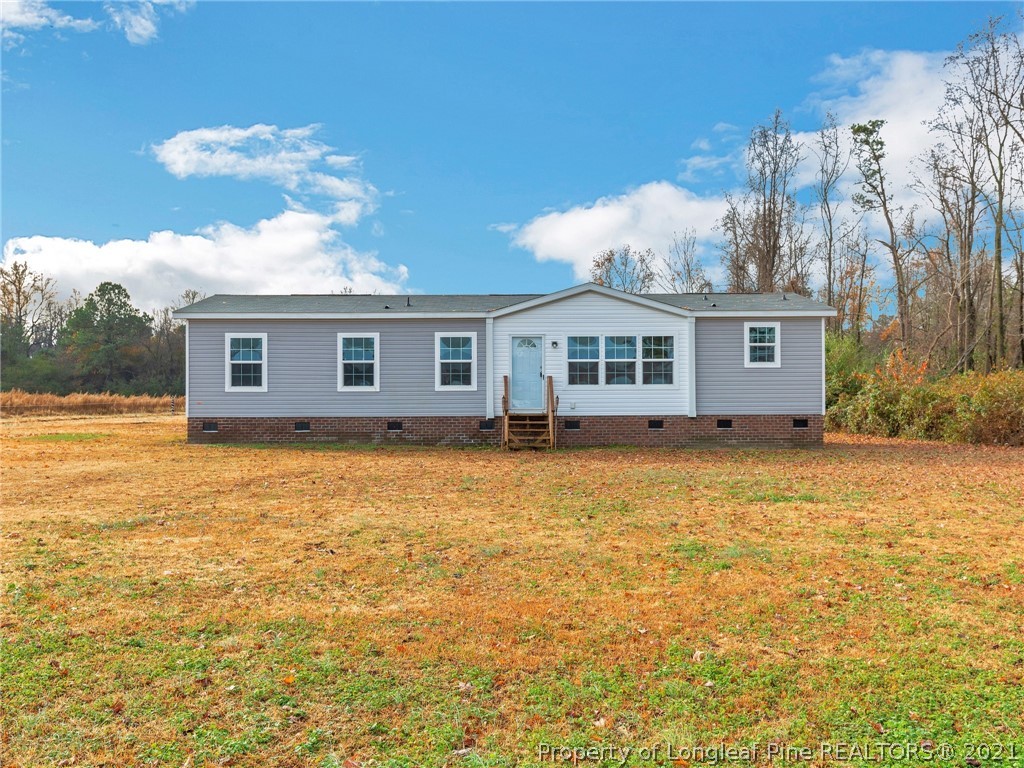 753 Mitchell Loop Road Roseboro, NC 28382 - Photo 1 of 30 a view of a house with a backyard