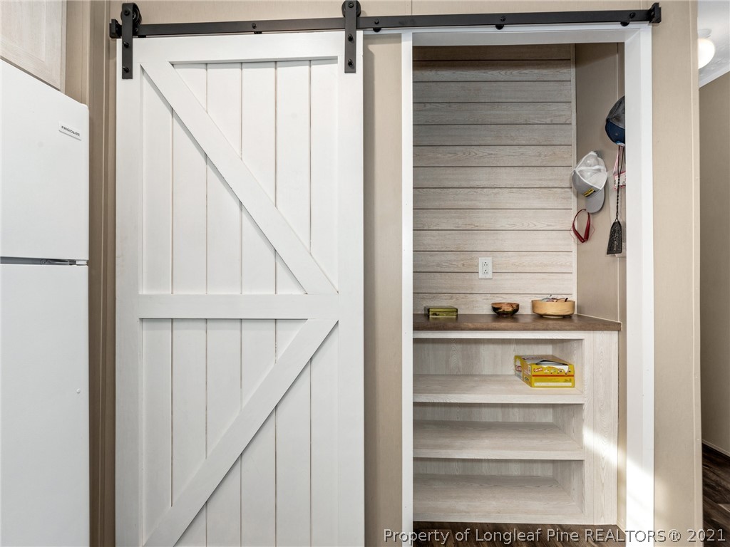 753 Mitchell Loop Road Roseboro, NC 28382 - Photo 11 of 30 a view of walk in closet with empty racks