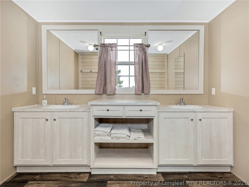 753 Mitchell Loop Road Roseboro, NC 28382 - Photo 18 of 30 a bathroom with a sink and a mirror