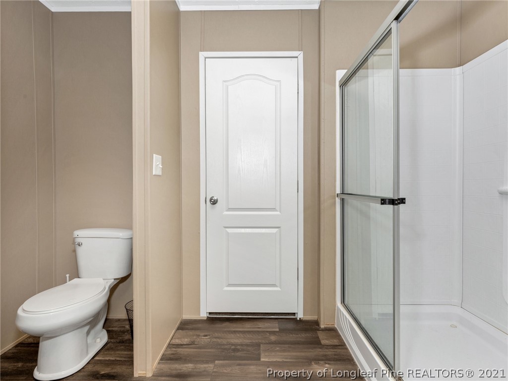 753 Mitchell Loop Road Roseboro, NC 28382 - Photo 20 of 30 a bathroom with a toilet and a shower