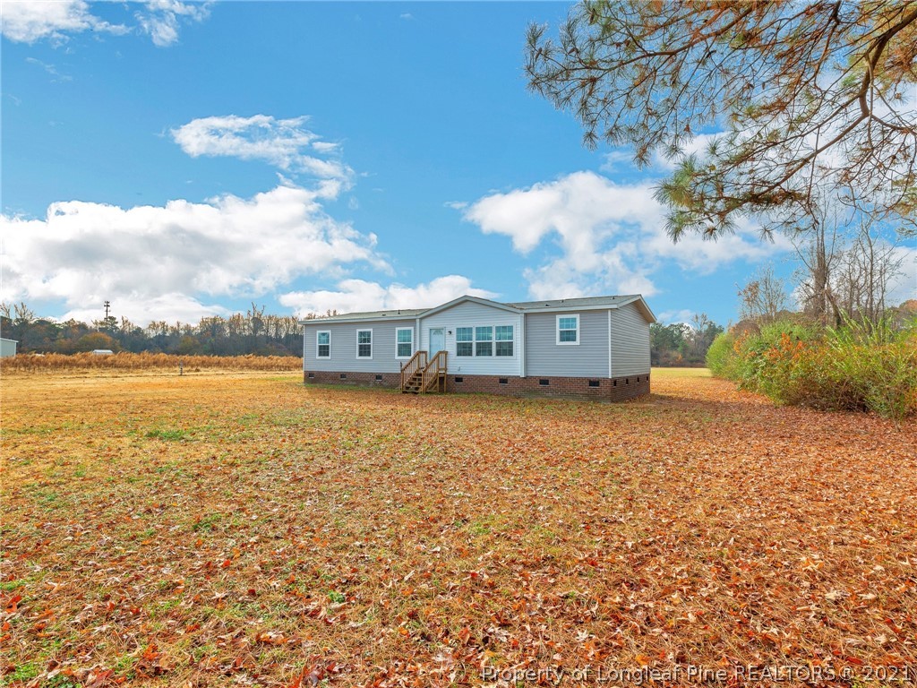 753 Mitchell Loop Road Roseboro, NC 28382 - Photo 2 of 30 a front view of a house with a yard