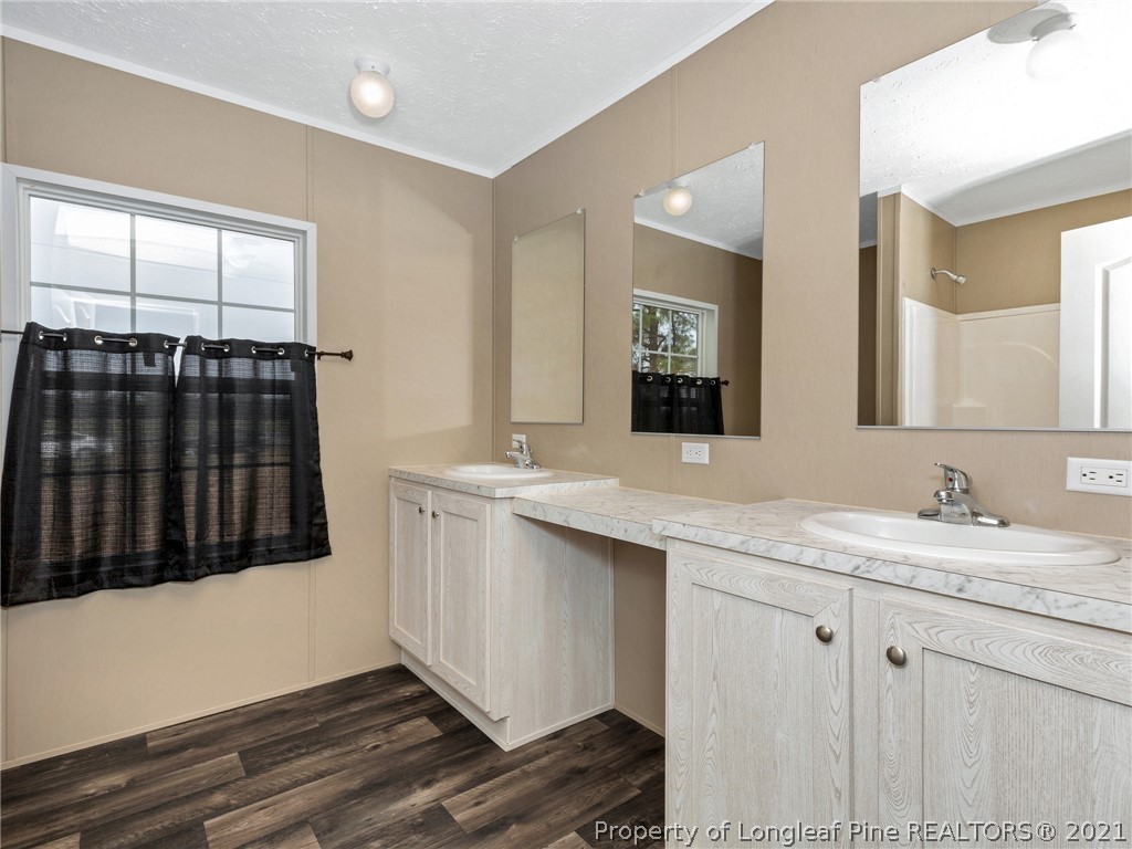 753 Mitchell Loop Road Roseboro, NC 28382 - Photo 23 of 30 a bathroom with a sink and a mirror