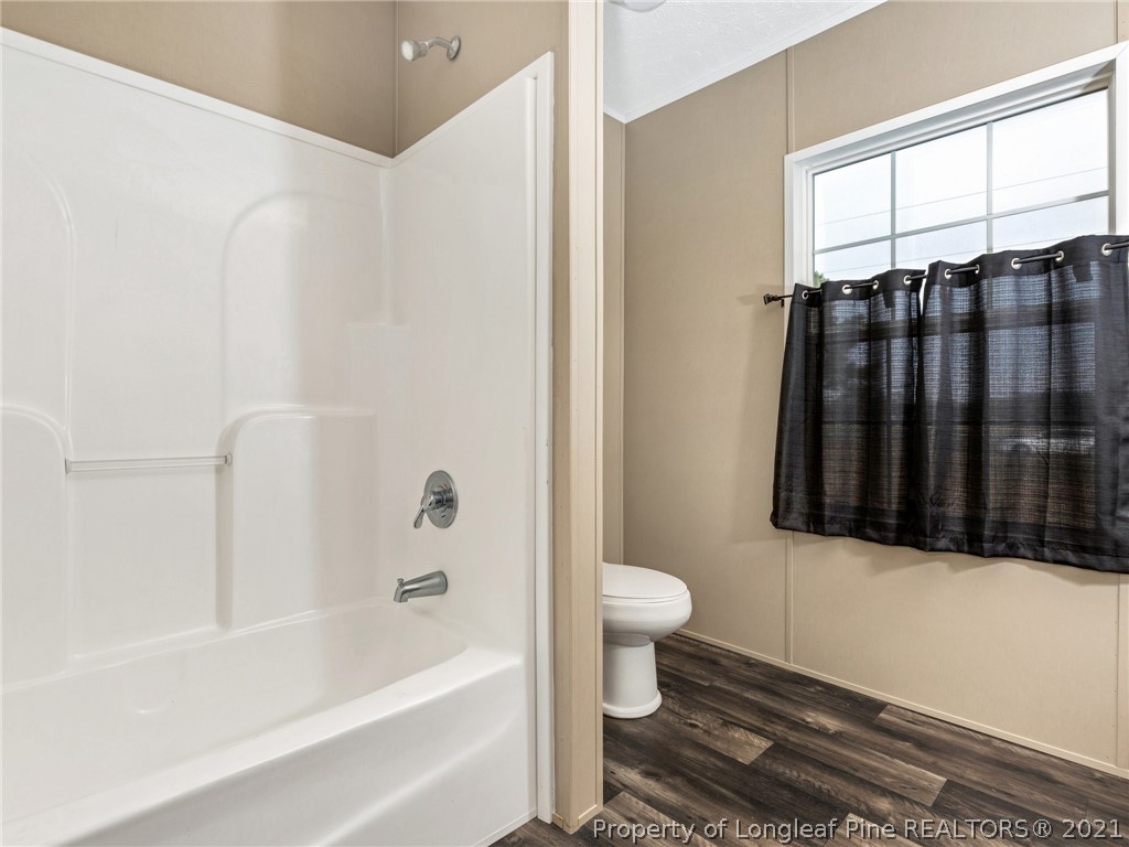 753 Mitchell Loop Road Roseboro, NC 28382 - Photo 24 of 30 a bathroom with a sink toilet and bathtub
