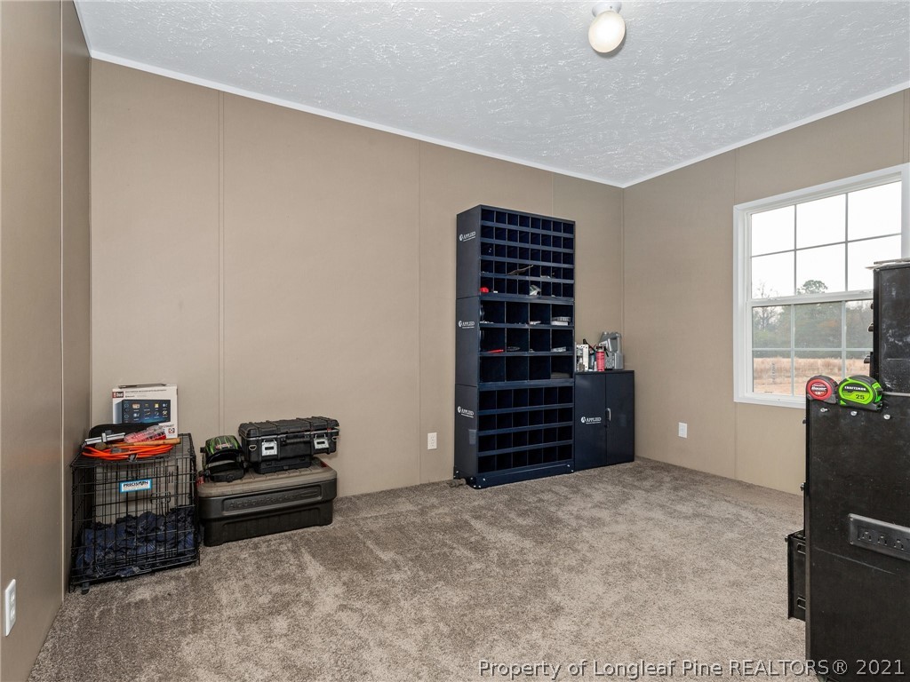 753 Mitchell Loop Road Roseboro, NC 28382 - Photo 25 of 30 a room with furniture and stairs
