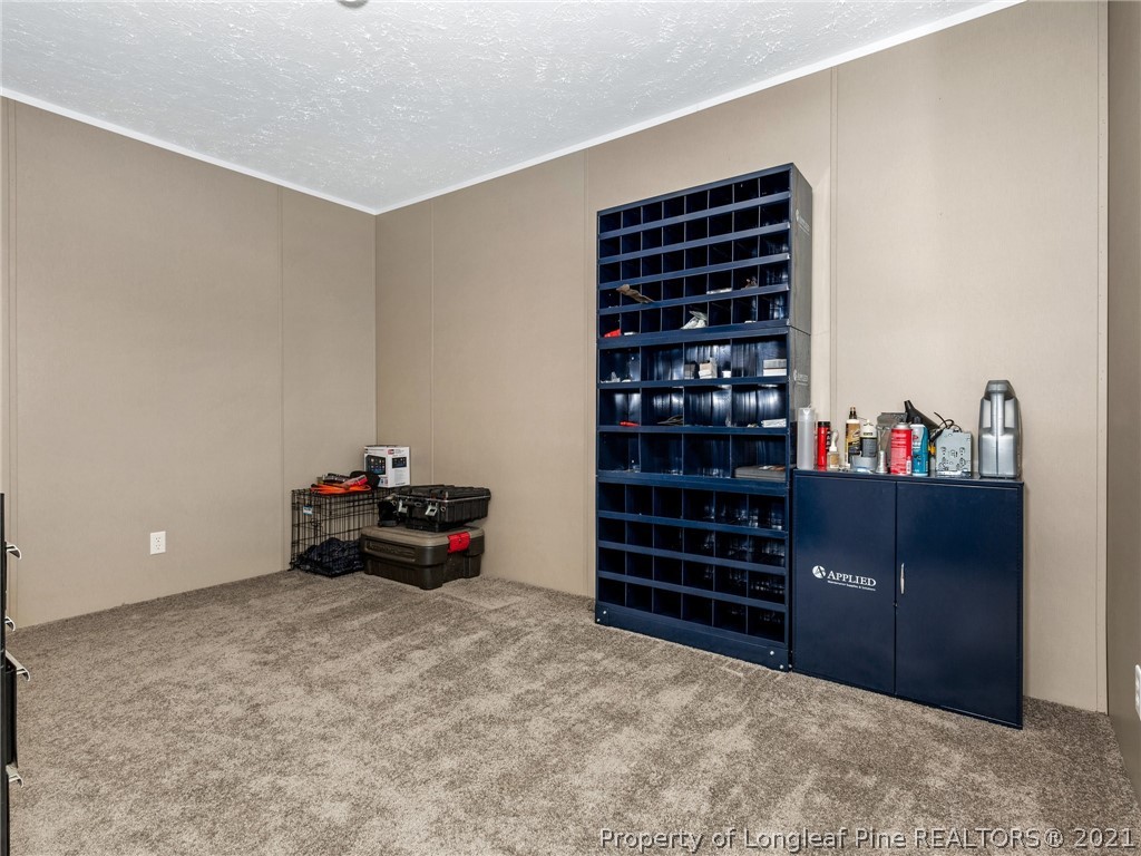 753 Mitchell Loop Road Roseboro, NC 28382 - Photo 26 of 30 a room with furniture and shoes