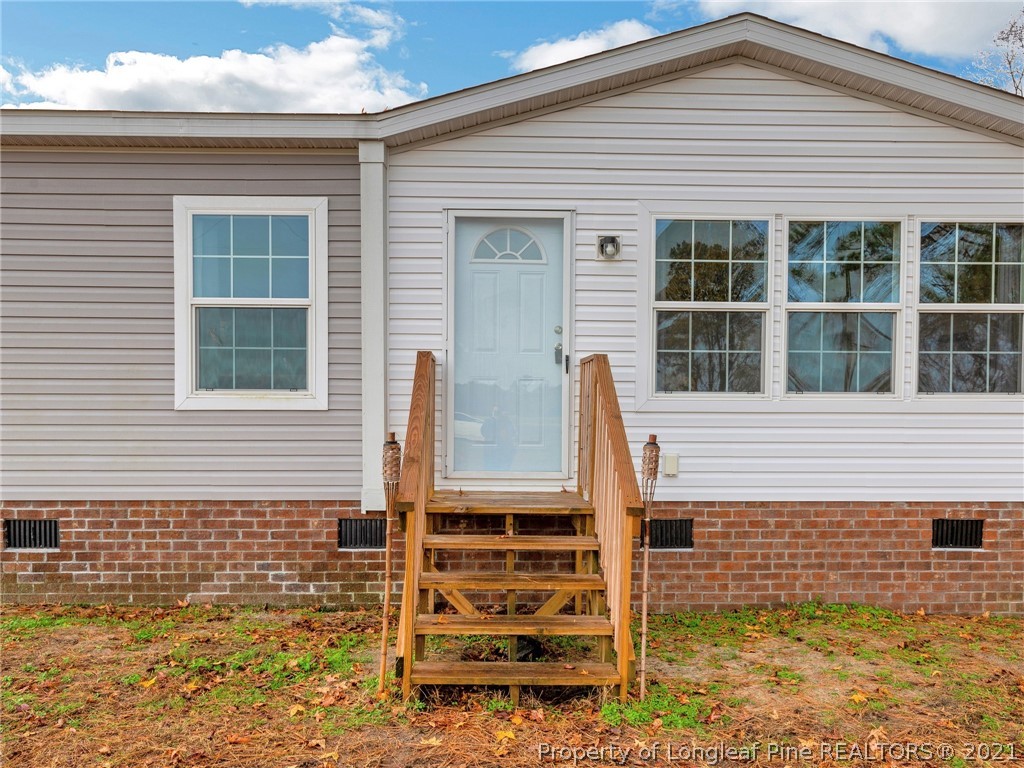 753 Mitchell Loop Road Roseboro, NC 28382 - Photo 3 of 30 a front view of a house with windows