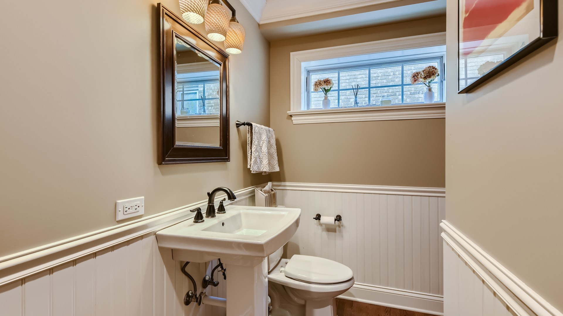 820 Hansen Place Park Ridge, IL 60068 - Photo 15 of 38 a bathroom with a sink a toilet and a mirror