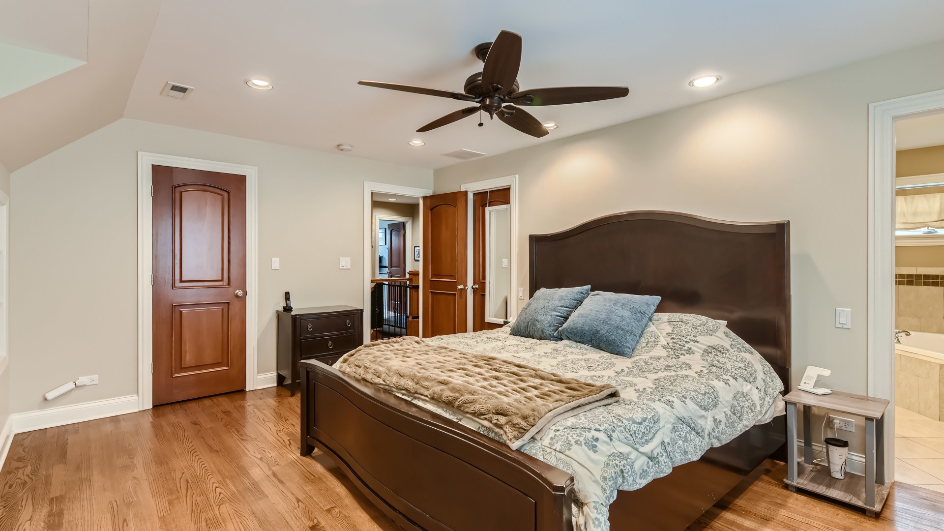 820 Hansen Place Park Ridge, IL 60068 - Photo 19 of 38 a bedroom with a large bed and a chandelier