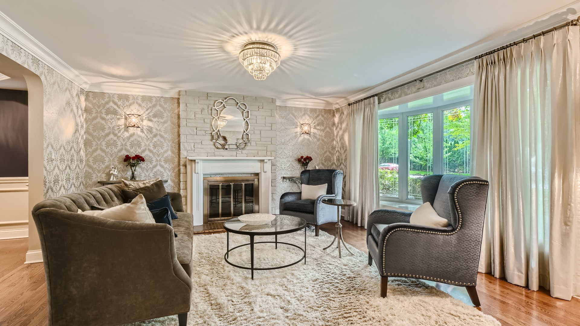 820 Hansen Place Park Ridge, IL 60068 - Photo 3 of 38 a living room with furniture chandelier and a fireplace