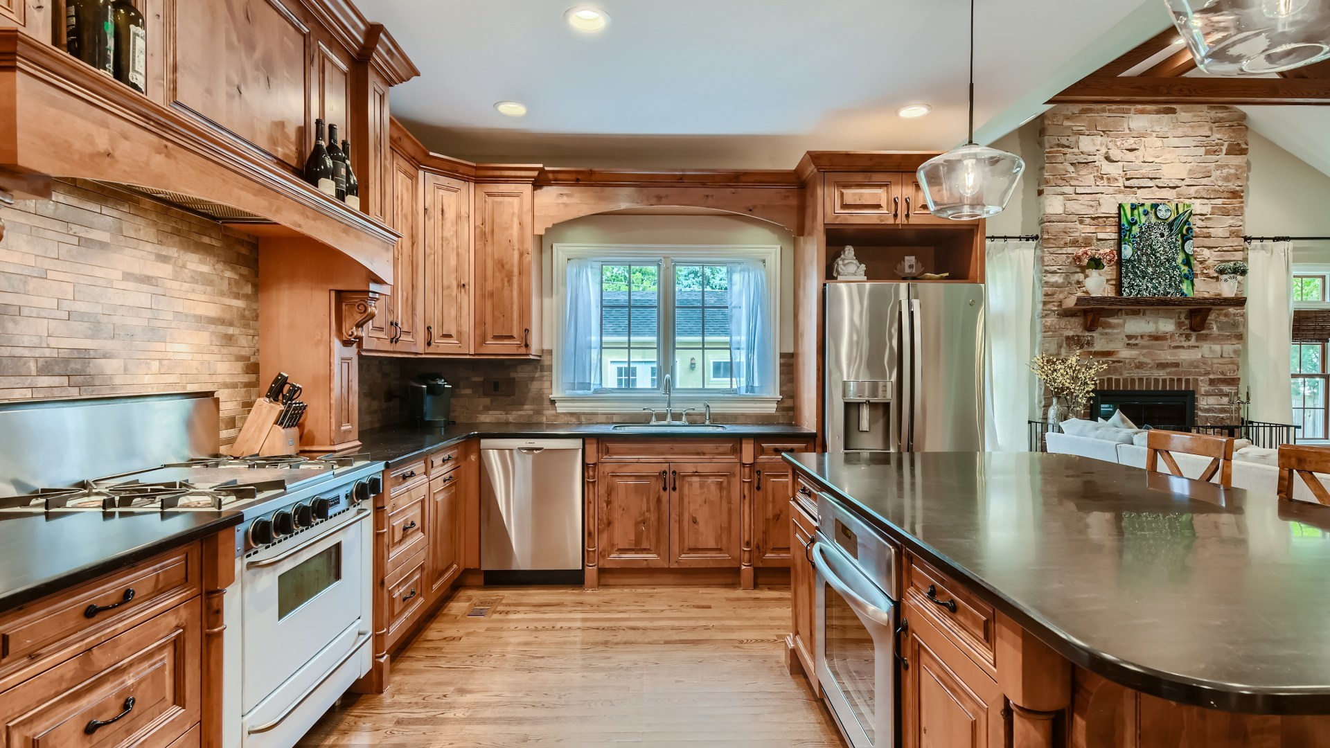 820 Hansen Place Park Ridge, IL 60068 - Photo 9 of 38 a kitchen with stainless steel appliances granite countertop a stove a sink and a refrigerator