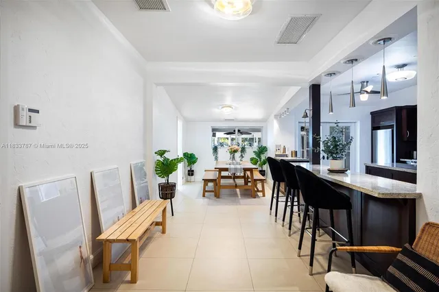 a kitchen with stainless steel appliances granite countertop a stove and cabinets