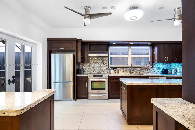 a view of a dining room with furniture and a potted plant